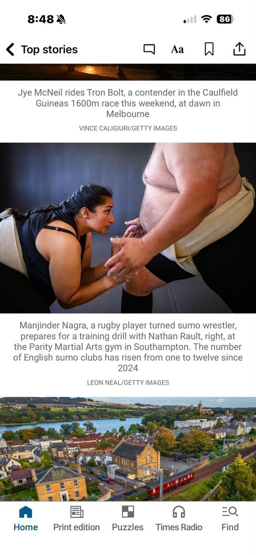 The Times mobile app “Top stories” feed showing the sumo photograph with a caption crediting Leon Neal/Getty Images.